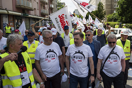 Piotr Duda (center), the chairman of the Independent Self-Governing Trade Union "Solidarnosc" and other members, seen during the demonstration.
Thousands of Polish coal mining industry workers protested in Warsaw against the gradual phasing out of coal use and against a European Union court order to immediately close down the Turow brown coal mine - the ruling was in response to a lawsuit by the neighboring Czech Republic which says the mine is draining water from its border villages.
The protest was organized by the Independent Self-Governing Trade Union "Solidarnosc" (Solidarity).