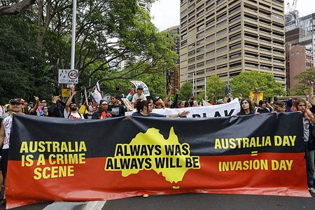 Protesters march holding a banner during an Invasion Day rally. Indigenous Australians and their allies gathered in Sydney for the annual Invasion Day protest, marking 26 January 1788 when Arthur Phillip raised the British flag at Sydney Cove. Observed by Indigenous communities as Invasion Day or Survival Day, the date symbolizes the beginning of colonization and its enduring impact on Aboriginal and Torres Strait Islander peoples. Meanwhile, another rally took place in the city, with far-right groups staging anti-immigration marches.