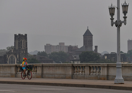 Brian Orbin the Clown Kid, seen riding his bicycle during the smoky haze that hangs in the air from the wildfires. Smoke from the Canadian Wildfires have reached Northeastern Pennsylvania casting a yellow haze. The Department of Environmental Protection has declared it a "code red" and advises people to stay inside.