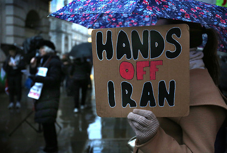 A protester holds a sign saying ‘Hands Off Iran’ during the demonstration. Protesters gather in Whitehall on International Women’s Day in support of Palestinian women. Demonstrators call for the release of Palestinian women held in Israeli detention and demand a ceasefire.