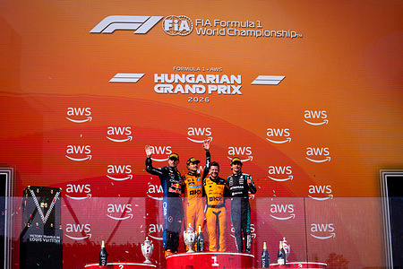 Max Verstappen (L) (NLD) (Oracle Red Bull Racing), Lando Norris (L2) (GBR) (McLaren Mastercard F1 Team), and Andrea Kimi Antonelli (R) (ITA) (Mercedes-AMG Petronas F1 Team) on the podium after the race of the Formula 1 Aws Hungarian Grand Prix 2026 at the Hungaroring