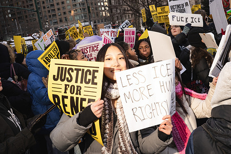 A woman holds up her signs during the national strike on Friday, January 30 2026 in New York, New York, USA. Organizers expect millions to participate in cities and towns across the nation in protest of the fatal shootings of Renee Nicole Good and Alex Pretti by federal immigration enforcement agents in Minnesota.