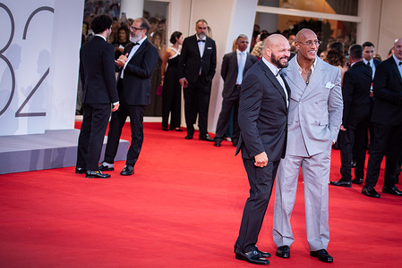 Mark Kerr and Dwayne Johnson attend "The Smashing Machine" red carpet during the 82nd Venice International Film Festival.