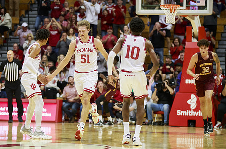 Indiana Hoosiers center Logan Duncomb (51) reacts after scoring against Bethune-Cookman Wildcats center Elijah Hulsewe (32) during an NCAA basketball game in Bloomington. 
Indiana beat the Bethune-Cookman Wildcats 101-49.