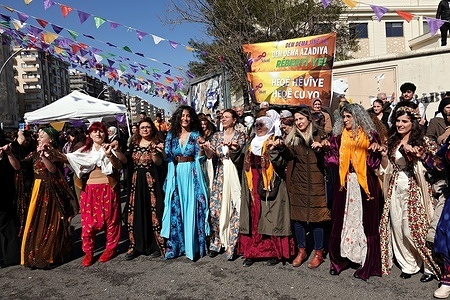 Kurdish women in traditional clothing are seen dancing during the March 8 International Women's Day celebration in Diyarbakir. Hundreds of Kurdish women gathered in Istasyon Square in Diyarbakir, Turkey, to celebrate International Women's Day on March 8th, dancing to music. The event was organized by Kurdish political parties and the Free Women's Movement (TJA).