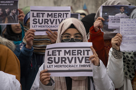Kashmiri medical students hold placards as they take part in a protest led by the ruling National Conference leader and member of Indian Parliament Aga Syed Ruhullah Mehdi outside the chief minister’s official residence in Srinagar's Gupkar Road demanding fairness and rationality in Jammu and Kashmir’s reservation policy. The demonstration, led by National Conference leader and Indian MP Aga Syed Ruhullah Mehdi, protested Jammu and Kashmir's new reservation policy, which increased reserved quotas to 60% while reducing the general category to 40%. Critics, including students from the open merit category, claim the policy is discriminatory. Introduced by the Lieutenant Governor-led administration, the policy reserves jobs and educational seats for groups such as Scheduled Castes, Scheduled Tribes, Other Backward Classes, and Residents of Backward Areas. Recent changes expanded these categories, introducing OBC reservations, and further reducing opportunities for the general category. Opponents argue the policy unfairly limits the chances of the general population and demands its reconsideration.