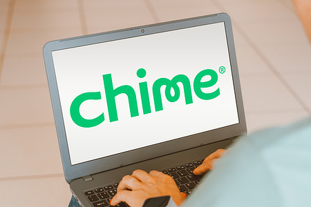 In this photo illustration, the Chime Financial, Inc. logo is displayed on a laptop screen.