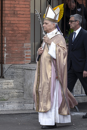 Pope Leo XIV arrives in procession to begin Mass during his visit to the parish of the Sacred Heart of Jesus in the Ponte Mammolo neighborhood.