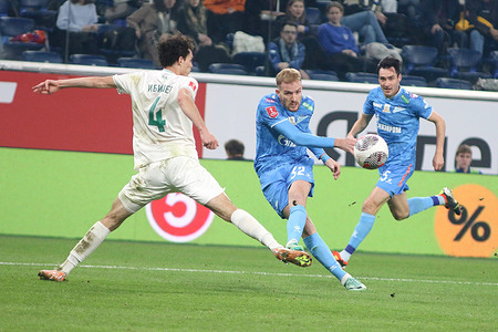 Turpal-Ali Ibishev (4) of Akmat, and Luciano Gondou (32) of Zenit seen in action during the 1/4 finals of the Russian Cup in the RPL, the first football match between Zenit Saint Petersburg and Akhmat Grozny at Gazprom Arena. Final score; Zenit 3:0 Akhmat.