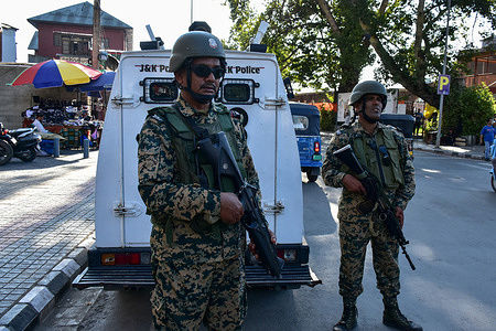 Paramilitary troopers stand alert ahead of the India's 80th Independence Day in Srinagar, the summer capital of Jammu and Kashmir.