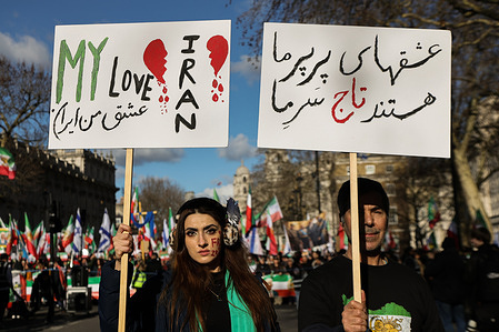 Iranian protesters with placards during a rally outside Downing Street in London, urging the UK government to support human rights and designate the Islamic Revolutionary Guard Corps (IRGC) as a terrorist organisation.