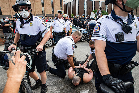 Columbus Police arrest a Black Lives Matter protester who stood in front of the cars the CPD were trying to tow in front of the Fraternal Order of Police.
Black Lives Matter activists protested against police brutality in the parking lot of the Fraternal Order of Police, blocking certain entrances to the parking lots with cars. Columbus Police Officers after a certain amount of time began towing cars that were blocking entrances to parking lots and streets. A few protesters were arrested and pepper sprayed in their efforts to prevent the detention of the cars.