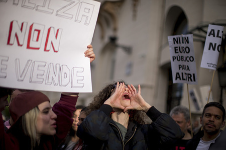 A protester shouts slogans, during a demonstration against the multinational company Altri, organized by Ulloa Viva, Ecologists in Action, and Greenpeace, demanding that the Spanish government not subsidize the multinational soluble cellulose and lyocell mega-plant project planned for Palas de Rei, Lugo.