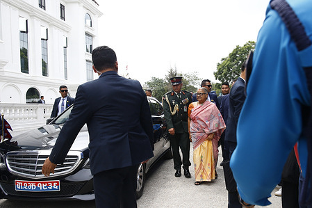 Interim Prime Minister Sushila Karki enters her office at Singha Durbar after officially assuming office in Kathmandu.