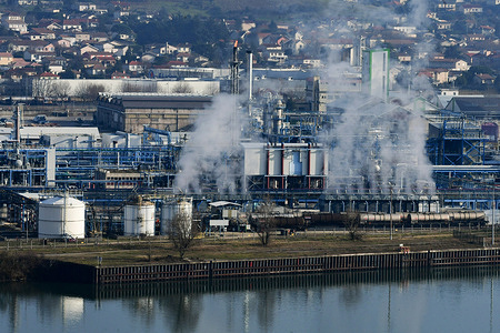 A factory is seen releasing off the smoke of the Adisseo group in Saint Clair du Rhone. An orange air pollution alert has been issued for the Rhone Valley in France, signaling a moderate level of pollution caused by high temperatures and stagnant weather. Ozone and particulate matter are accumulating, posing risks to sensitive groups like the elderly, children, and those with respiratory conditions. Authorities advise limiting outdoor activities during peak pollution hours.