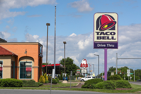 The logo for Taco Bell is seen on the sign outside of the fast food restaurant.