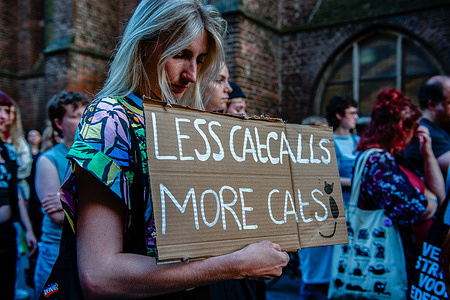A woman seen holding a placard against catcalls (a loud insulting remark or whistle). Hundreds of men and women took part in a march against intimidation and sexual violence on the street during a demonstration called 'Witches Night'. In places where women are often harassed, they wrote texts in chalk on the ground that expressed the usual sentences that men use to molest them, and feminist texts, so the people passing by could read them. The so-called 'Witch Night' is an initiative of the collective 'Catcalls of Nimma' and the first time it was held was in 1978.