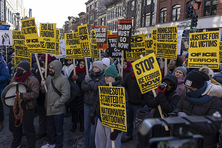 Demonstrators hold signs during a rally in Chinatown to protest U.S. Immigration and Customs Enforcement enforcement actions and President Donald Trump’s immigration policies as part of nationwide demonstrations and a planned “no work, no school, no shopping” general strike against ICE. The actions in the nation’s capital coincide with protests in cities across the United States, calling for an end to aggressive immigration enforcement and accountability for recent controversial federal enforcement actions.