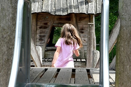 A young girl plays at the Blaches lake in the village of Saint Maurice l'Exil.