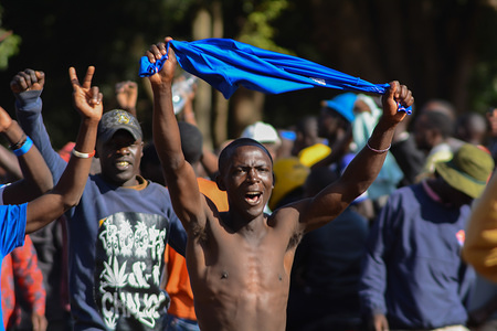 A National Super Alliance (NASA) Coalition supporter seen shouting slogans at Uhuru Park, in readiness to the expected swearing of the Coalition's leaders Raila Ondinga as the President of the Republic of Kenya. The Kenyan government has repeatedly said the event is illegal and treasonous since Uhuru Kenyatta is already in the office as the President of Kenya.