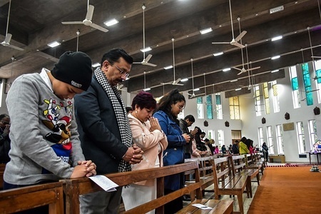 Christian devotees pray during the celebration at Christ King Church in Chandigarh.
Christian community celebrated Christmas; the birthday of Jesus Christ Jesus Christ with zest and gaiety. Among those who prayed were tourists from different parts of the world who joined the locals on the auspicious day and prayed for peace.