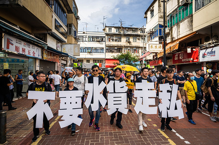 Protesters seen holding placards during the demonstration.
Thousands of protesters took to the street of the Sheung Shui district in northern Hong Kong in an anti parallel trading march. Some protesters clashed with the police after the march. Numbers of protesters are reported to be injured.