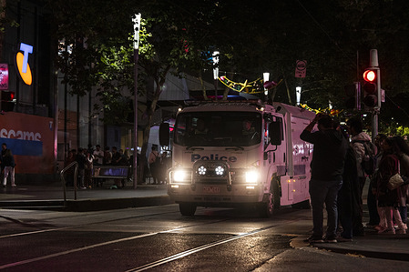Victoria Police are seen patrolling Bourke Street after the midnight fireworks display. Melbourne celebrates the arrival of 2026, large crowds gather in the city to watch the fireworks display under a heightened police presence.