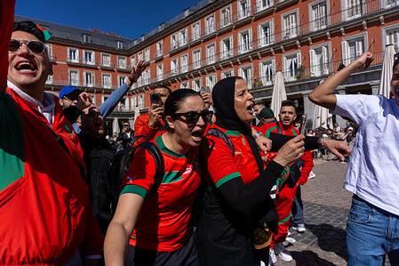 Moroccan women shout slogans in support of their national football team. Moroccan fans gather in Madrid's Plaza Mayor hours before their national football team's friendly match against Ecuador at the Metropolitano Stadium.