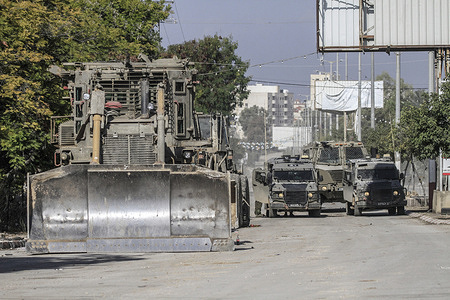 Israeli occupation bulldozers closed and roamed the streets of the city of Jenin in the West Bank, during a military operation carried out by the Israeli occupation forces. The raid resulted in the destruction of the infrastructure, sewage networks, the central market and shops, and the martyrdom of two Palestinians, one was a gunman and the other one was school student.