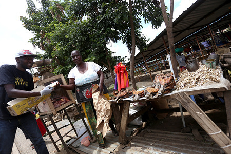 A member of the Mng’aro Mtaani group led by Samuel Omolo Tores donates soap bars to an elderly woman as a preventive measure against the spread of Coronavirus at Baba Dogo slum in Nairobi.
There are more than 2.5 million people living in slums across Nairobi city who besides the pandemic, may badly suffer social-economic effects. Kenyan government has announced possibilities of a lockdown. Majority of the dwellers live under two dollars a day, this without running water, poor road network and food shortage. Kenya confirmed 122 cases of coronavirus and four deaths.
