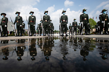 Nepalese soldiers stand on guard while wearing face masks as a preventive measure ahead of the presentation of the government's policies and programs for the upcoming fiscal year at the parliament during the Coronavirus (COVID-19) lockdown crisis.
Nepal has so far confirmed 278 coronavirus cases with 35 recovered.