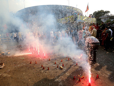 Bharatiya Janata Party workers burn firecrackers as they celebrate party's victory in Uttar Pradesh, Uttarakhand, Manipur and Goa State Assembly elections at BJP State headquarters. Bharatiya Janata Party is set to retain power in Uttar Pradesh, Uttarakhand, Manipur and Goa, while Aam Aadmi Party has snatched Punjab from Congress.