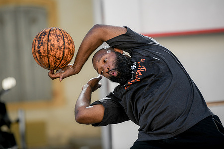 The performer of 'Basketball' showcases his skills, executing a basketball trick during the Festival in La Place du Palais des Papes. The Festival d'Avignon has started in France, offering a month-long celebration of theatre in the medieval city. Held in the center of Avignon, this 77th edition features a diverse program of performances.