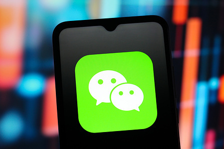In this photo illustration, the WeChat App (We Chat) logo is seen displayed on a smartphone screen.