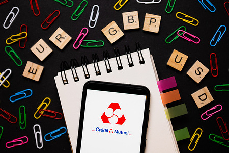 In this photo illustration, a Credit Mutuel logo seen displayed on a smartphone.