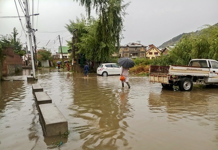 Residents wade during the heavy rains in Srinagar.
Heavy rains caused water-logging in many areas of Srinagar exposing the poor drainage system of the city. The weather department has predicted more precipitation in many parts of the valley in the next 24 hours.