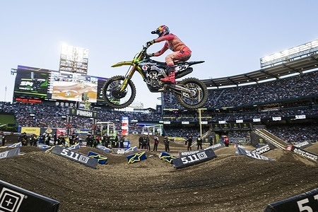 R.J. Hampshire (24) seen jumping through the whoop section during the main event race. Monster Energy Supercross Championships Anaheim, California.