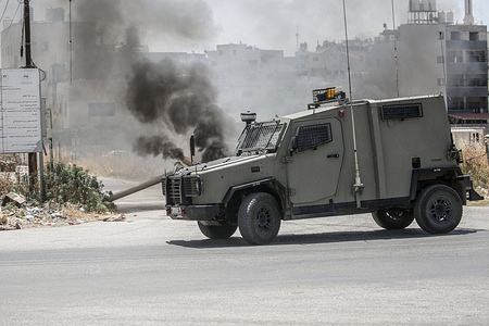 Israeli military vehicles patrol neighborhoods inside the Askar refugee camp. A large-scale arrest campaign was launched, and homes were raided and their contents vandalized. Israeli forces arrested a number of Palestinians during the military operation, and dozens were injured by severe beatings and tear gas.