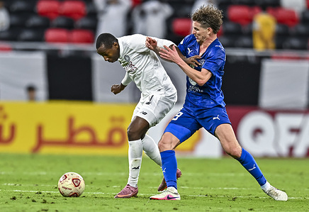 Mohamed Camara (L) of Al Sadd SC and Bourigeaud Benjamin (R) of Al Duhail SC seen in action during the Amir Cup 2026 Semi Final match between Al Sadd SC and Al Duhail SC at Ahmad bin Ali Stadium.Final score; Al Sadd SC 4 : 1 Al Duhail SC .
