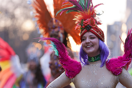 A dancer from the London School of Samba takes part in the annual New Year's Day Parade in London. On January 1, 2026, the London New Year’s Day Parade celebrated the theme “Global London,” with more than 8,000 performers from across the UK and around the world. Marching bands, dancers, acrobats, cheerleaders, and historic vehicles paraded from Piccadilly Circus to Whitehall and Parliament Square. Tens of thousands of Londoners and tourists line the route. Dancers, acrobats, cheerleaders, marching bands, and historic vehicles take part in a display combining contemporary performances with traditional pomp and ceremony.