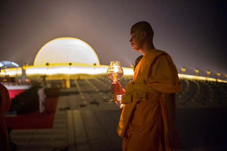 A monk seen walking around the temple while holding a lantern during the yearly Makha Bucha ceremony in the north of Bangkok.
Buddhist devotees celebrate the annual festival of Makha Bucha, one of the most important day for buddhists around the world. More than a thousand monks and hundred of thousand devotees were gathering at Dhammakaya Temple in Bangkok to attend the lighting ceremony.