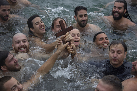 Swimmers retrieve the 'Holy Cross' from the water, whoever retrieves it first is said to be blessed for a year. The Orthodox Blessing of the Water festivities were held at Princess Pier. Despite severe weather, the celebrations continued.