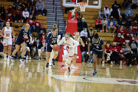Indiana Hoosiers guard Nicole Cardano-Hillary (No.4) steals the ball from Penn State during the National Collegiate Athletic Association (NCAA) women's basketball game in Bloomington.
Indiana University beats Penn State with a final score of 70-40.
