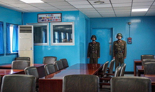 Soldiers from North Korea seen guarding inside the joint security area, or the "blue house", of Panmunjom. The truce village of Panmunjom inside the Demilitarised Zone (DMZ) separates North and South Korea since 1953. The military demarcation line is seen from North Korea's side.