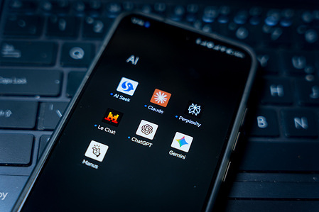 In this photo illustration, the apps of various AI chatbots, including Perplexity, Claude, Chat GPT, Gemini and Mistral, seen displayed on a smartphone.