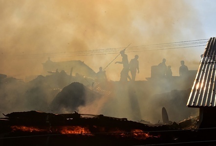 Kashmiri locals and firemen work to put out flames after it has engulfed several houses in Srinagar, Indian administered Kashmir. A massive fire engulfed five residential houses in Bachi Darwaza area of old city in Srinagar. Fire tenders were quick to douse the flames. A fire started out from one the houses and spread to several others.