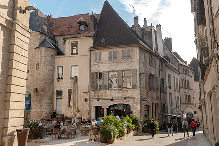 Café culture and beautiful architecture of Dole in the Jura region beside the River Doubs and Rhine-Rhone canal, a historical city located southeast of Dijon.