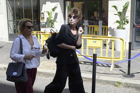 Veronica Piveti (r) arrives at the chapel of rest during Pippo Baudo at the Teatro delle Vittorie.