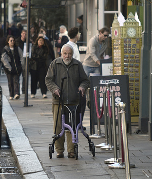 Film director and screenwriter Mike Leigh is seen out and about in Soho, London, using a walking aid