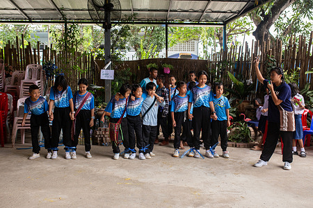 Children seen preparing to play a game. Migrant students put on dazzling traditional dances and participated in lively sports games to celebrate World Children's Day. The event was organized collaboratively by 13 schools managed by the Burmese Migrant Workers Education Committee (BMWEC).